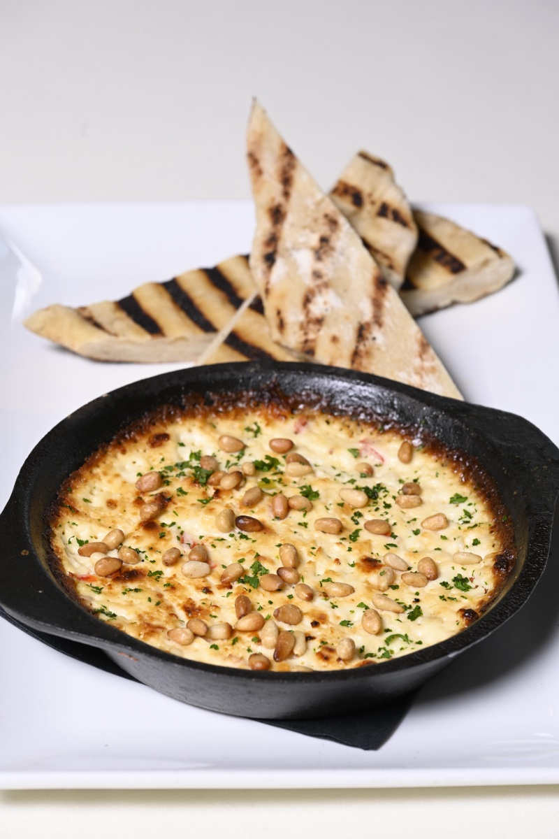 Warm feta cheese dip with flatbread